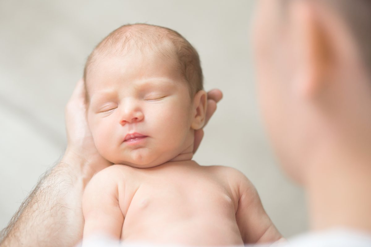 portrait-newborn-hold-father-palms-1200x800.jpg